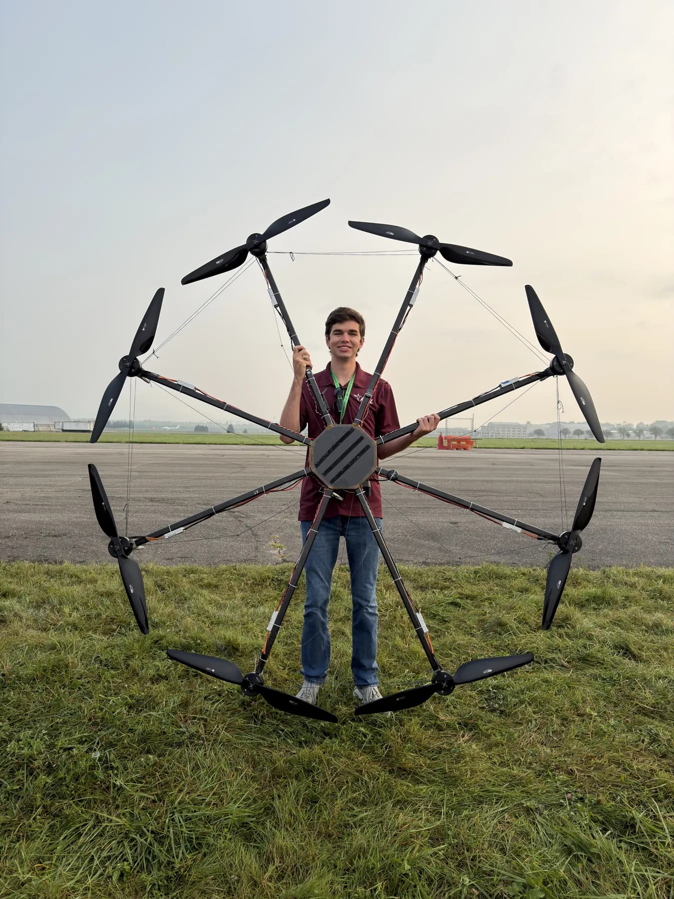 Kyle Bedrich holding a heavy-lift octocopter